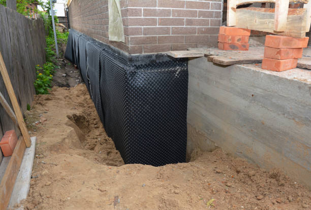 Happy homeowners after waterproofing job in Castalian Springs